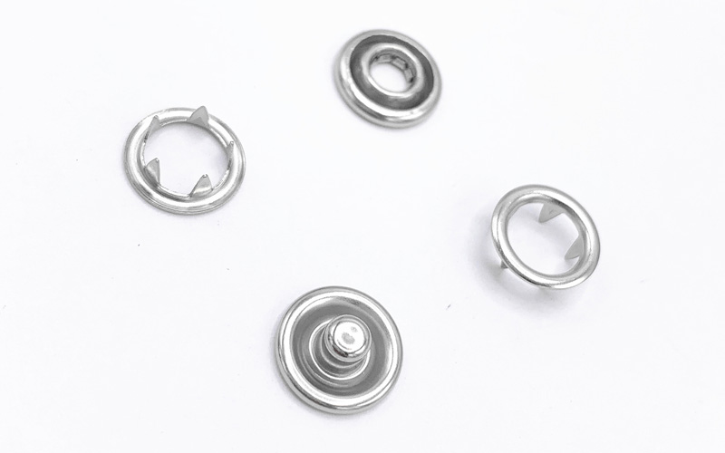 AB亚洲钮扣：高品质不锈钢空心五爪扣，助力童装安全与时尚